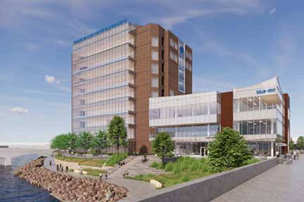 the renovated LV. Eberhard Center featuring the Blue dot lab, as viewed from the Grand Rapids blue bridge